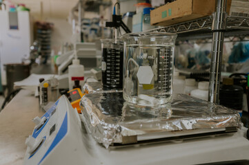 Laboratory glassware, such as flasks, test tubes with different chemicals in a laboratory.