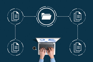 Concept document management system or DMS. A person with a laptop works with data archives.