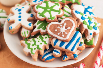 Glazed homemade gingerbread cookies. A plate with christmas sweets