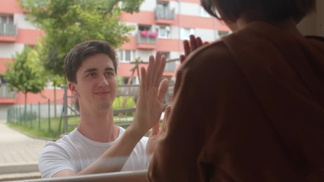 Creative male babysitter playing with child due to social distancing. Easy games to play with just hands will keep kids busy anywhere. 