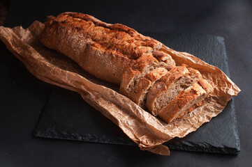 baguette of buckwheat flour without yeast on a black background
