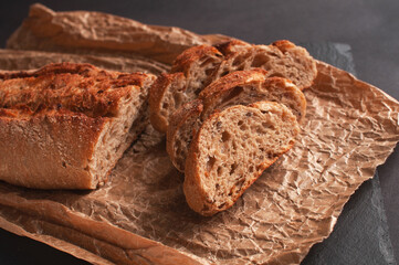 baguette of buckwheat flour without yeast on a black background