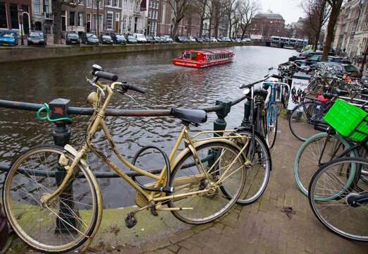 Gold Bike and Boat on Amsterdam Cama;