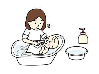 泣いている赤ちゃんを沐浴させる母親