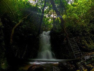Long exposure view of Jamblon waterfall (Cascade Jamblon) hidden in a forest located in the north-east of Mauritius island