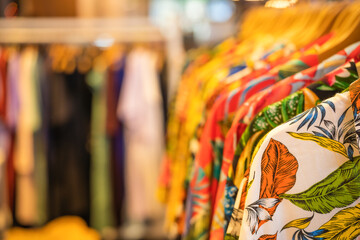 shirt and clothes for summer hanging on a shelf