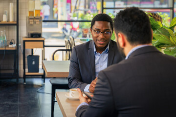 business colleague have business talk and brainstorming in coffee shop