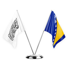 Two table flags isolated on white background 3d illustration, afghanistan and bosnia