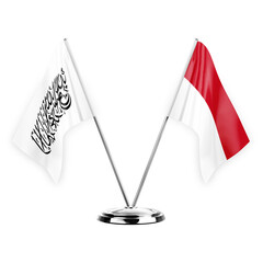 Two table flags isolated on white background 3d illustration, afghanistan and monaco