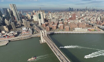The stunning aerial view of the bridge and skyscrapers in Manhattan, taken from a helicopter ride in New York City, U.S.A