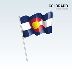 Waving flag of Colorado state of United States of America on gray background