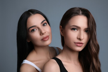 Fototapeta premium Portrait of beautiful women on grey background