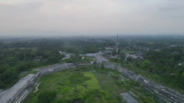 Aerial video of the sabo dam of the Gendol river blocking the cold lava flow of Mount Merapi, Yogyakarta, Indonesia.