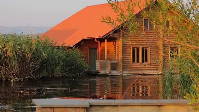 Idyllic Scenery Of A House By The Water Near Lake Sevan, Armenia. Sideways.