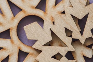 closeup of wooden textured snowflakes. christmas wooden pattern. wood carving