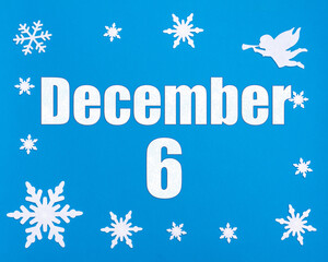 December 6th. Winter blue background with snowflakes, angel and a calendar date. Day 6 of month.