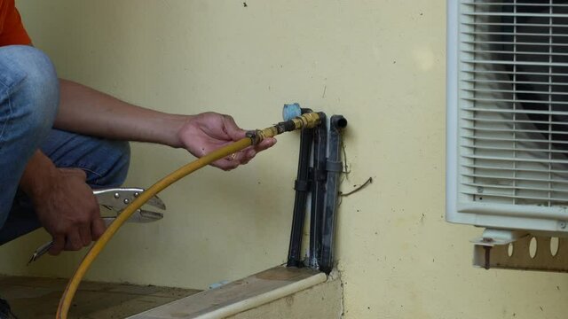 Technician service compress chemical pesticide for termite killing through house underground pipe structure