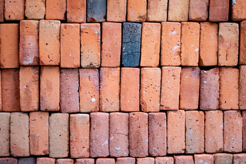 Stacked red bricks