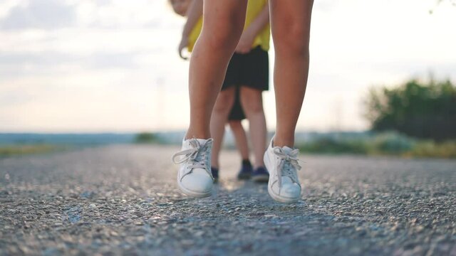 kids play classics hopscotch in the schoolyard. school kid a dream concept. playground children concept. kids jumping play on the asphalt hopscotch. game play outdoor fun
