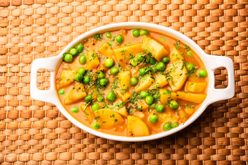 Aloo Mutter curry or green peas potato curry - obrazy, fototapety, plakaty