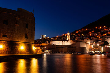 Fototapeta na wymiar Dubrovnik city old port marina and fortifications seen from Porporela