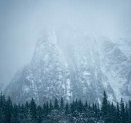 Misty moody mountain cliffs with fresh autumn snow in Washington