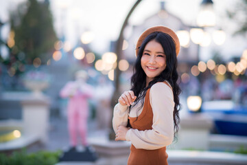 Portrait of an Asian woman at Christmas and various bokeh on her own lifestyle.