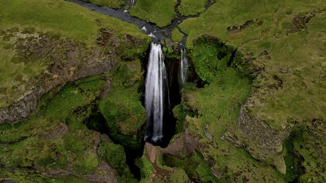 Cinematic aerial footage of the Beautiful Seljalandsfoss and Gljufrabui waterfalls in Iceland on summer