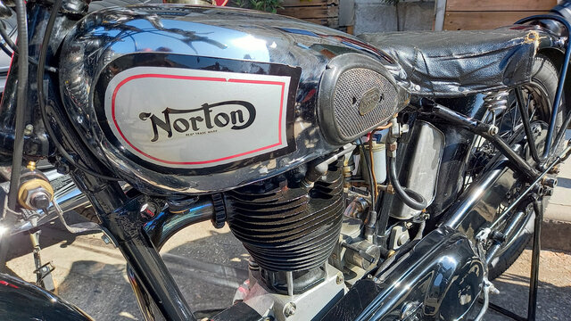 Norton motorcycle brand logo and sign text on chrome tank fuel of oldtimer vintage old silver retro classic motorbike
