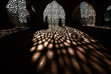 Islamic background photo. Shadows of decoration of the mosque.