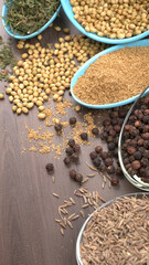 Dry coriander seeds with small bamboo spoon and green fresh bunch coriander leaves,famous spices ingredients in asia's kitchen.