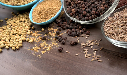 Dry coriander seeds with small bamboo spoon and green fresh bunch coriander leaves,famous spices ingredients in asia's kitchen.