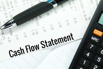 pen, calculator, receipt and word cash flow statement