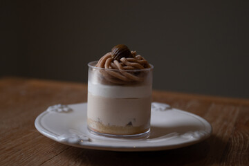 A cup of Mont Blanc Cake , dark grey background