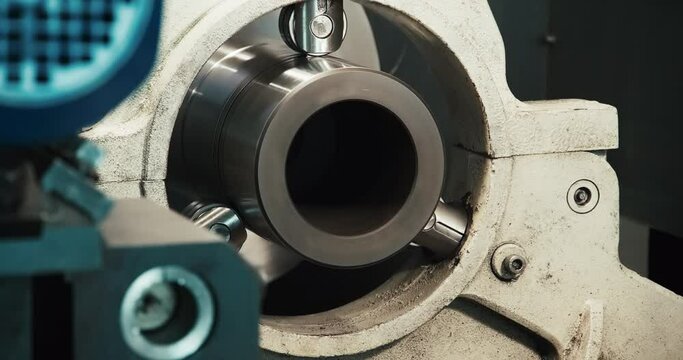 Detail of a lathe cutter with a carbide insert when machining a duralumin cylindrical part. Treatment.
