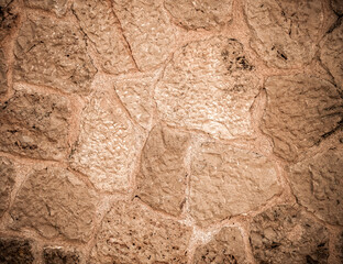 rough natural brown stone wall closeup, space for your text