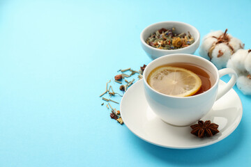 Concept of hot drink with tea on blue background