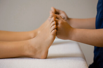 Foot massage in hotel spa center