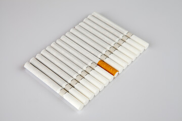 Pile of cigarettes over white background 
