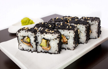 Sushi rolls Japanese delicacies. Japanese traditional rice and fish dishes. Beautiful serving food on a light background with copy space. A set of delicious goodies.