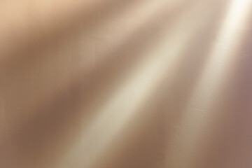 Wall with sunbeams. Golden beige wall background with bright sunlight