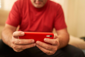hands of a man using smartphone
