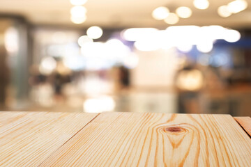Perspective empty wooden table on top over blur background, can be used mock up for montage products display or design layout.