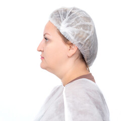 Full-face portrait of a young woman in a medical cap before cosmetic procedures isolated on a white...