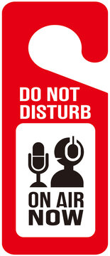 Do not disturb sign for studio door handle. No entry, podcast on air now.