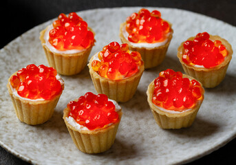 Red caviar in tartlets, close up