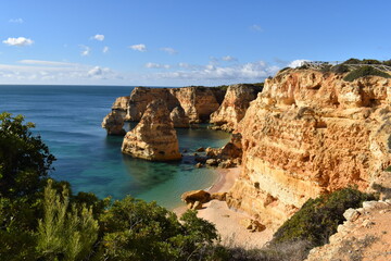 The colorful and beautiful coastline with cliffs and beaches along the Algarve in Portugal