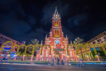 Tan Dinh church, special pink worship place in Ho Chi Minh. The sentence on the plate means Tan...