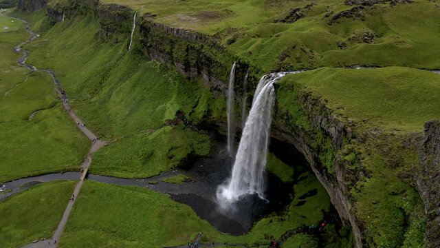 Cinematic aerial footage of the Beautiful Seljalandsfoss and Gljufrabui waterfalls in Iceland on summer