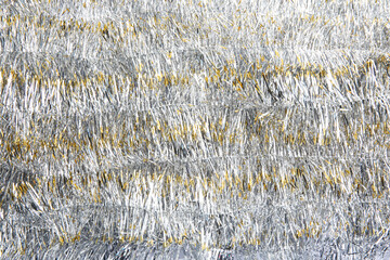 Sparkling bright tinsel as background. Festive decoration